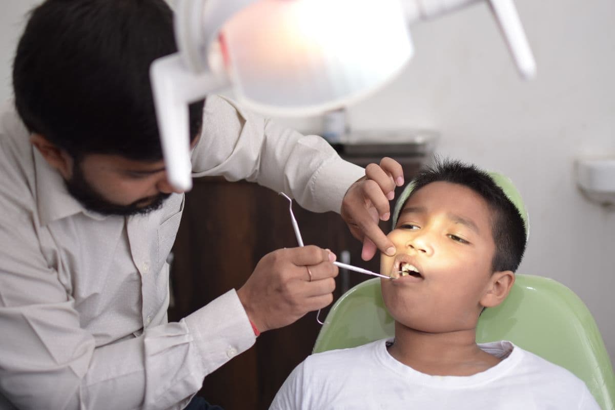 Young child sitting in a dental chair during a check-up